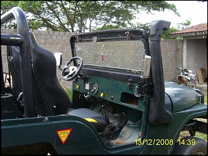 Volante Shutts, Snorkel com logomarca Jeep, retrovisores BLAWER cromados, chaves do caa na cor amarela para farol de milha, ao fundo minha moto...